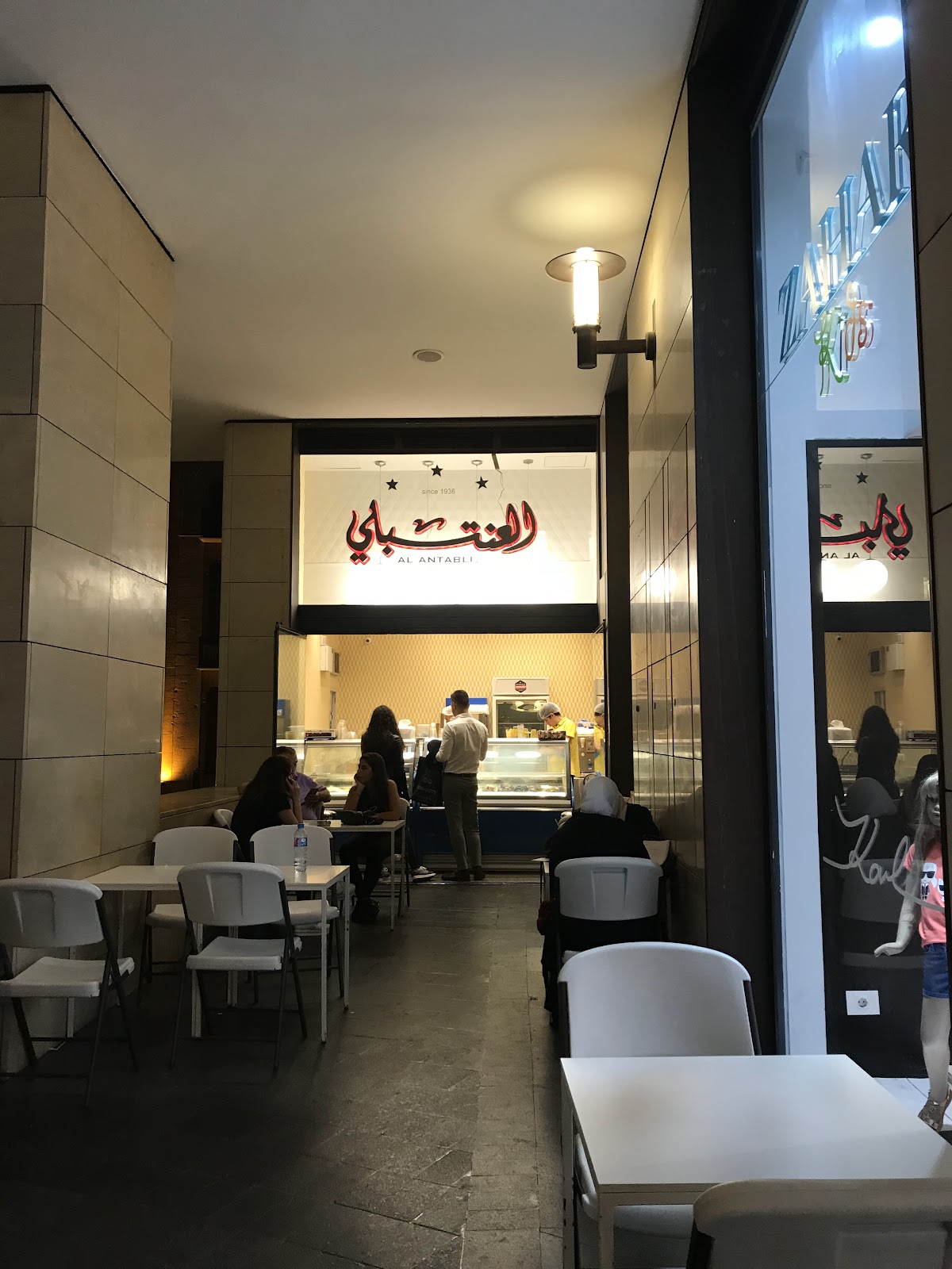 The Al Antabli storefront inside Beirut Souks, sign lit in the evening