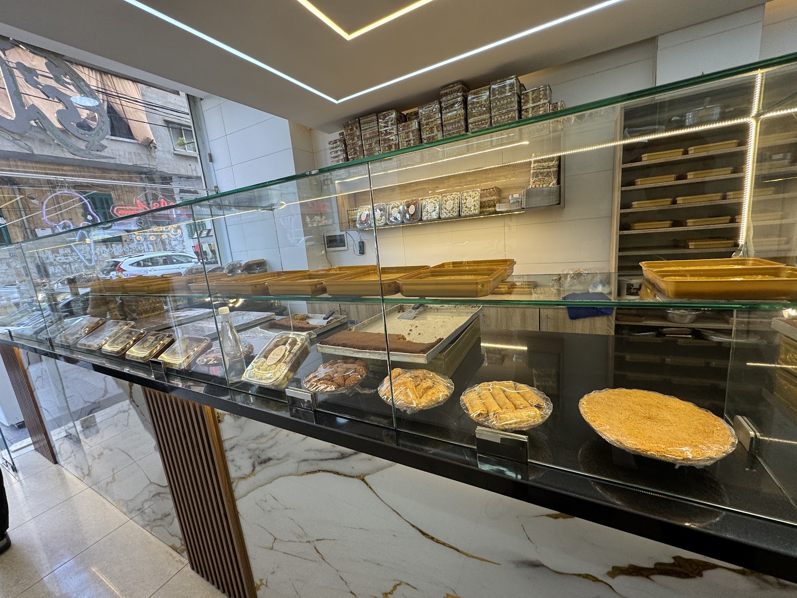 The marble counter and glass vitrine inside Al Makari
