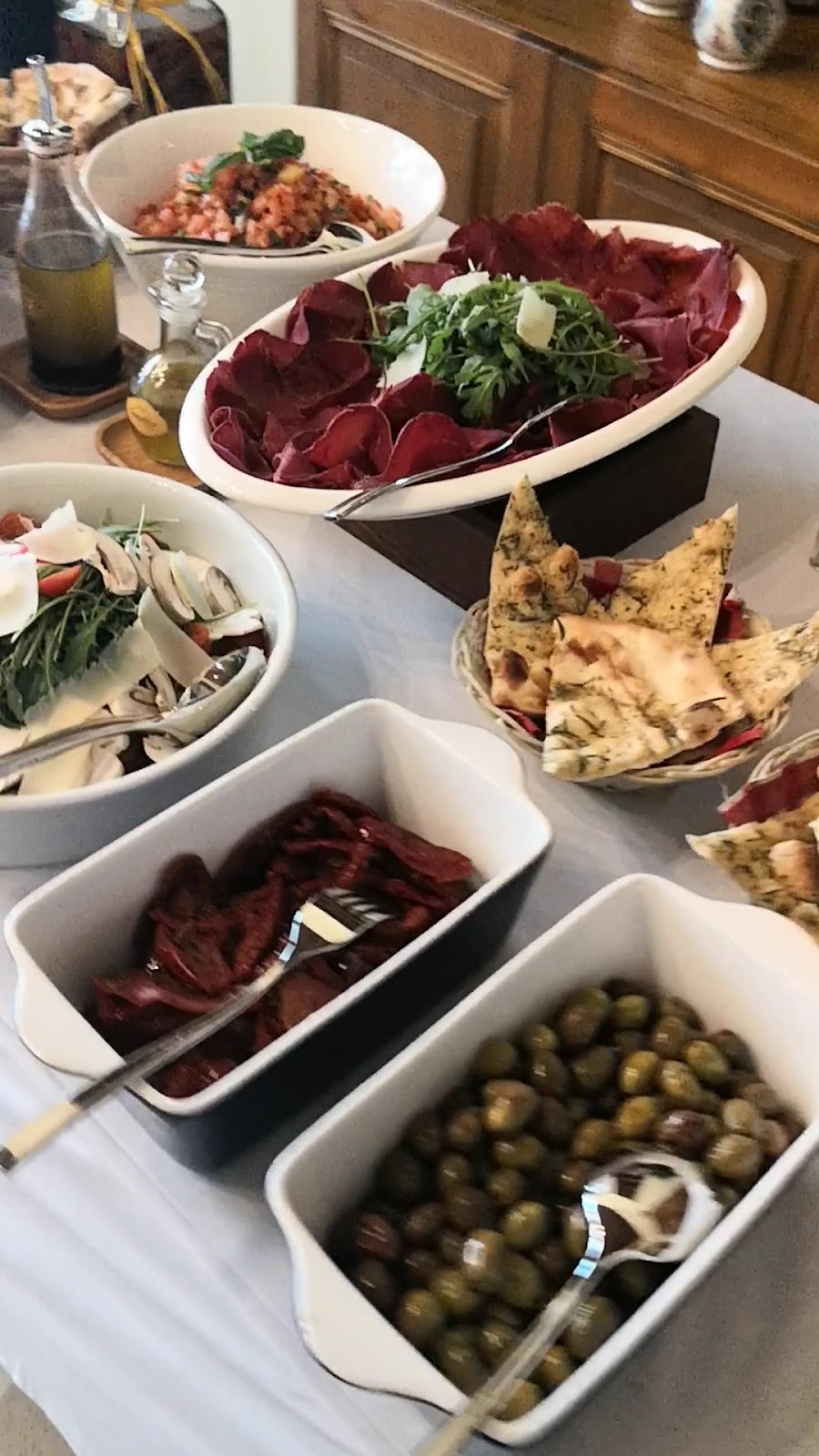 Antipasti boards with olives, bresaola and bread