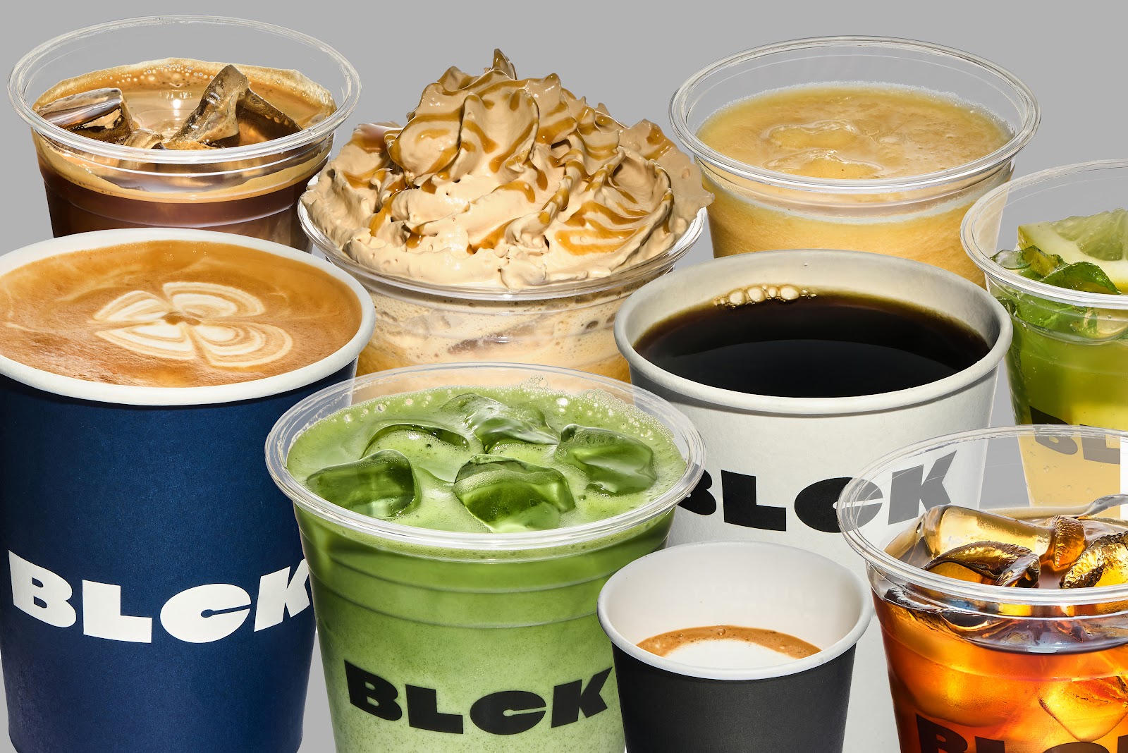 The BLCK line-up: latte, cold brew, filter coffee, iced matcha and iced tea in their own black and navy cups