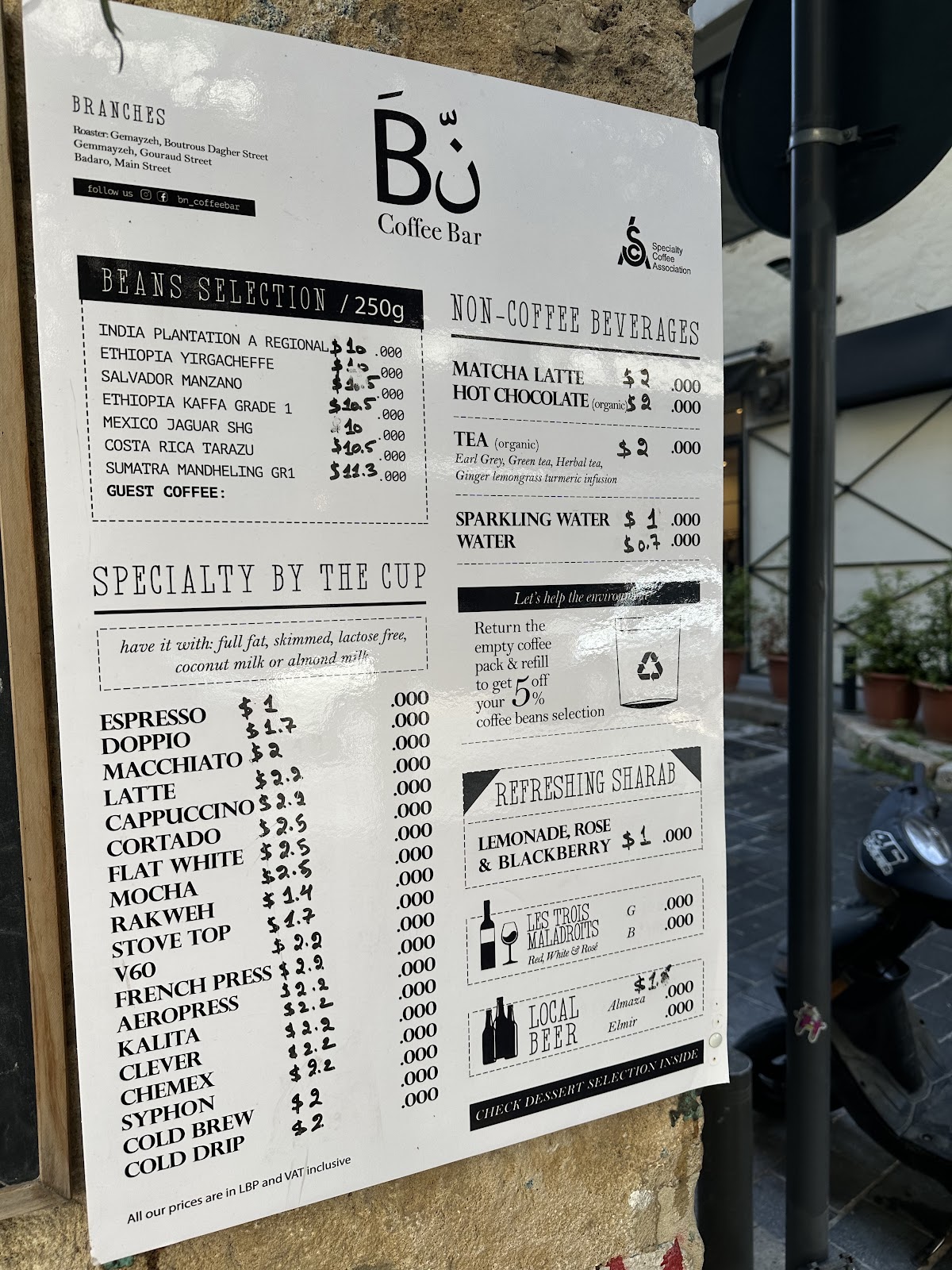 The Bn Coffee Bar price board hung at the door
