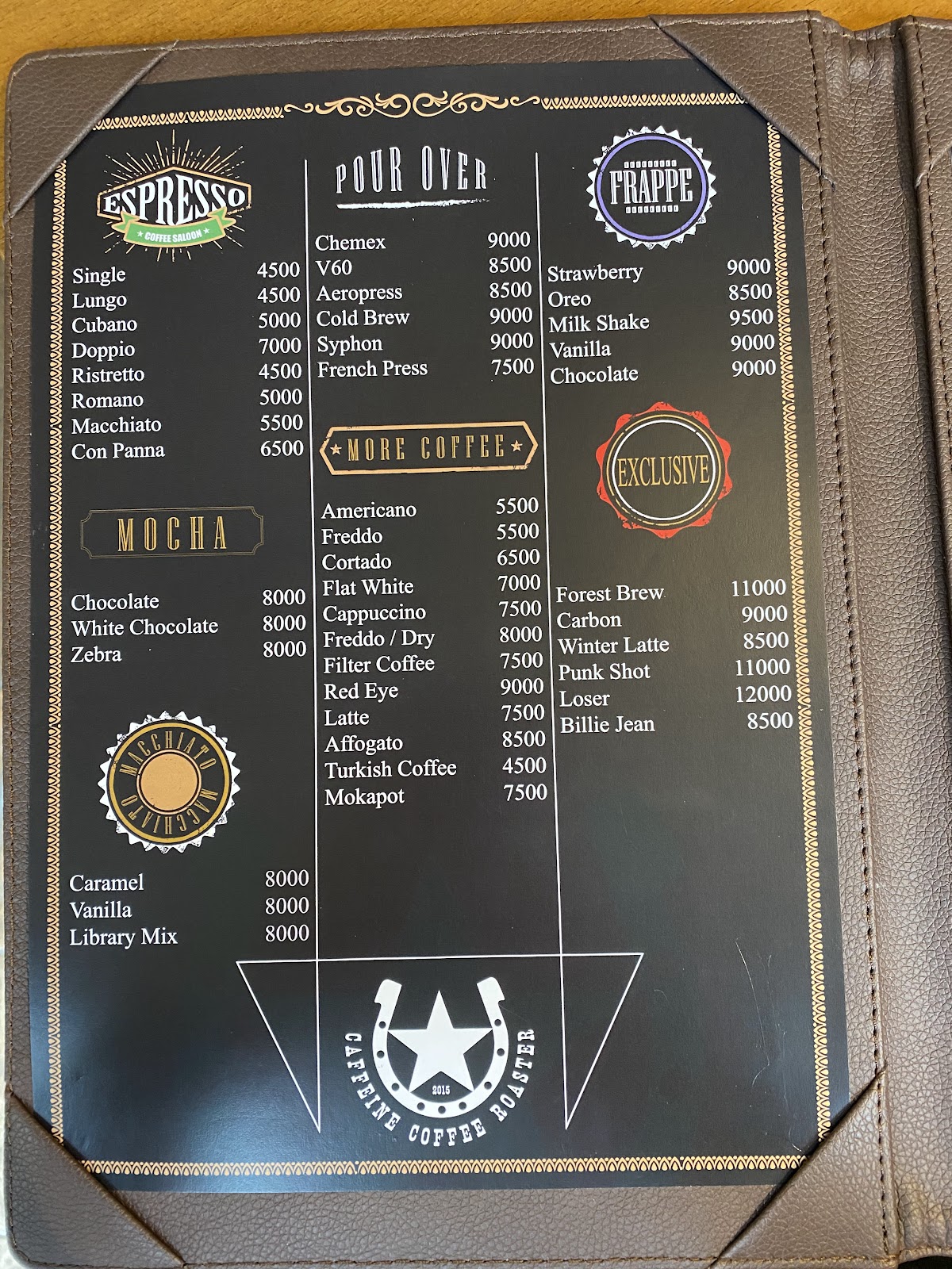 The leather bound menu book of Caffeine Coffee Roaster