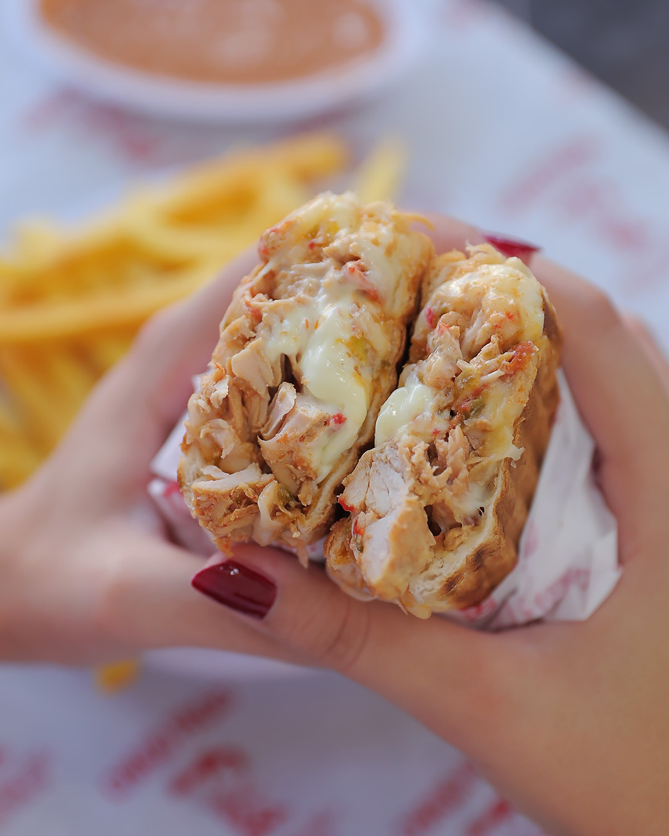 The Chaud Froid chicken sub split open, grilled chicken and melted cheese inside