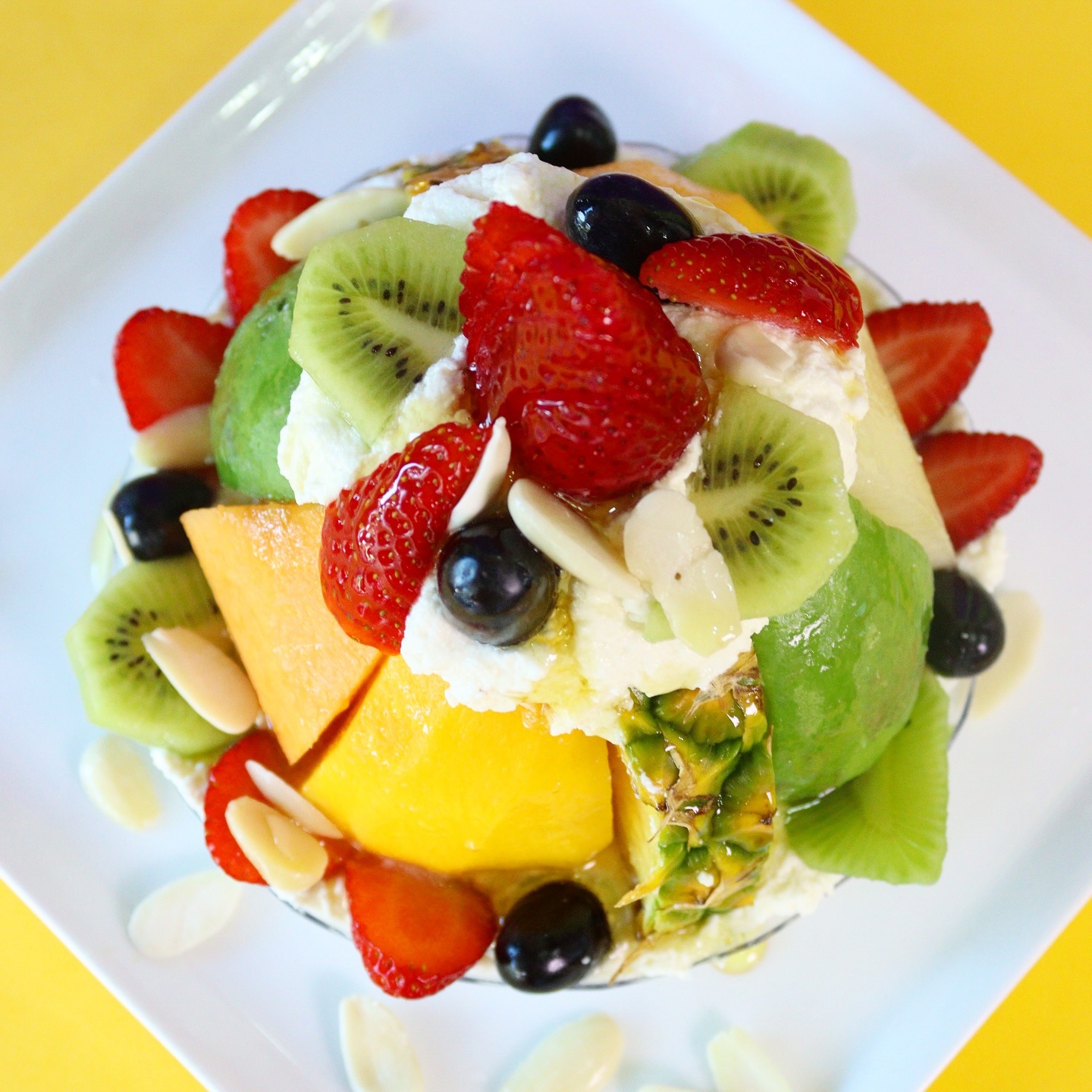 A bowl of cut fruit