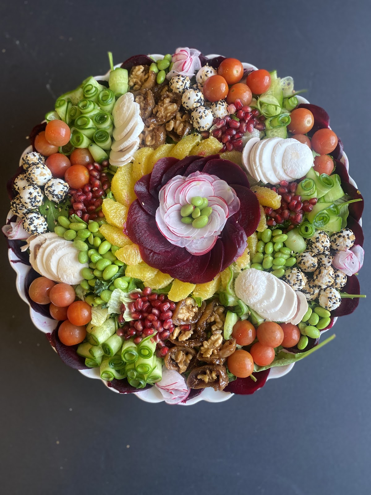 A large sharing platter of salad and mezze from above