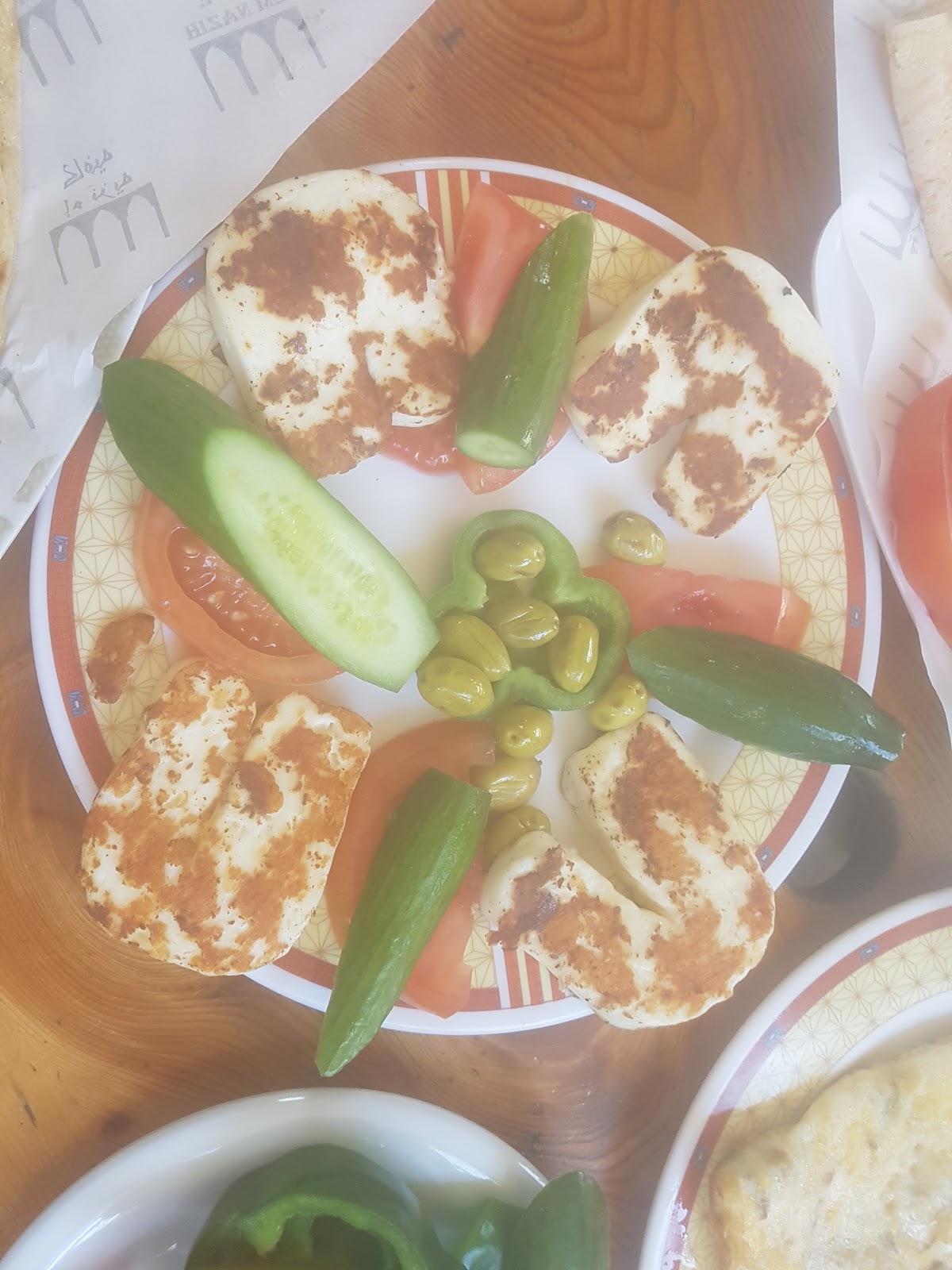 Grilled halloumi plate with cucumber, tomato and olives