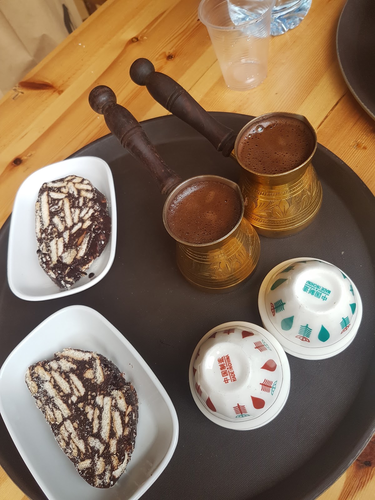 Copper rakwe pots and mosaic dessert served on a tray