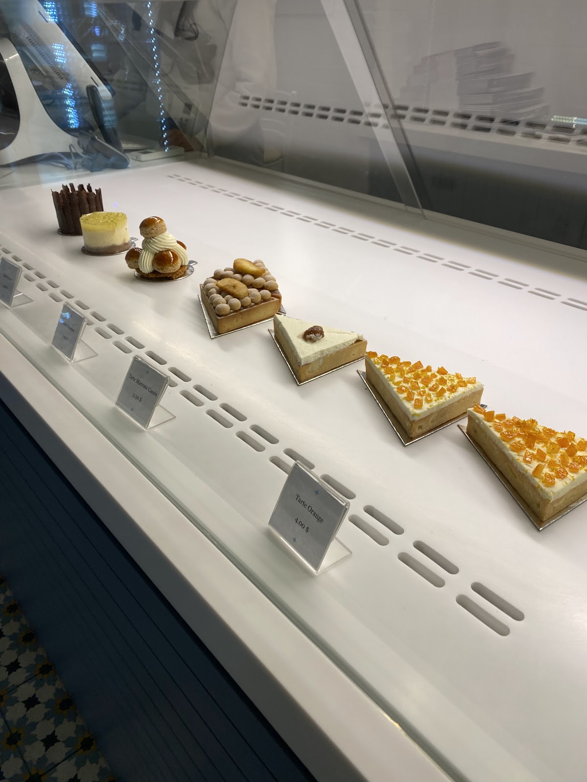 A row of petits gateaux in the display case