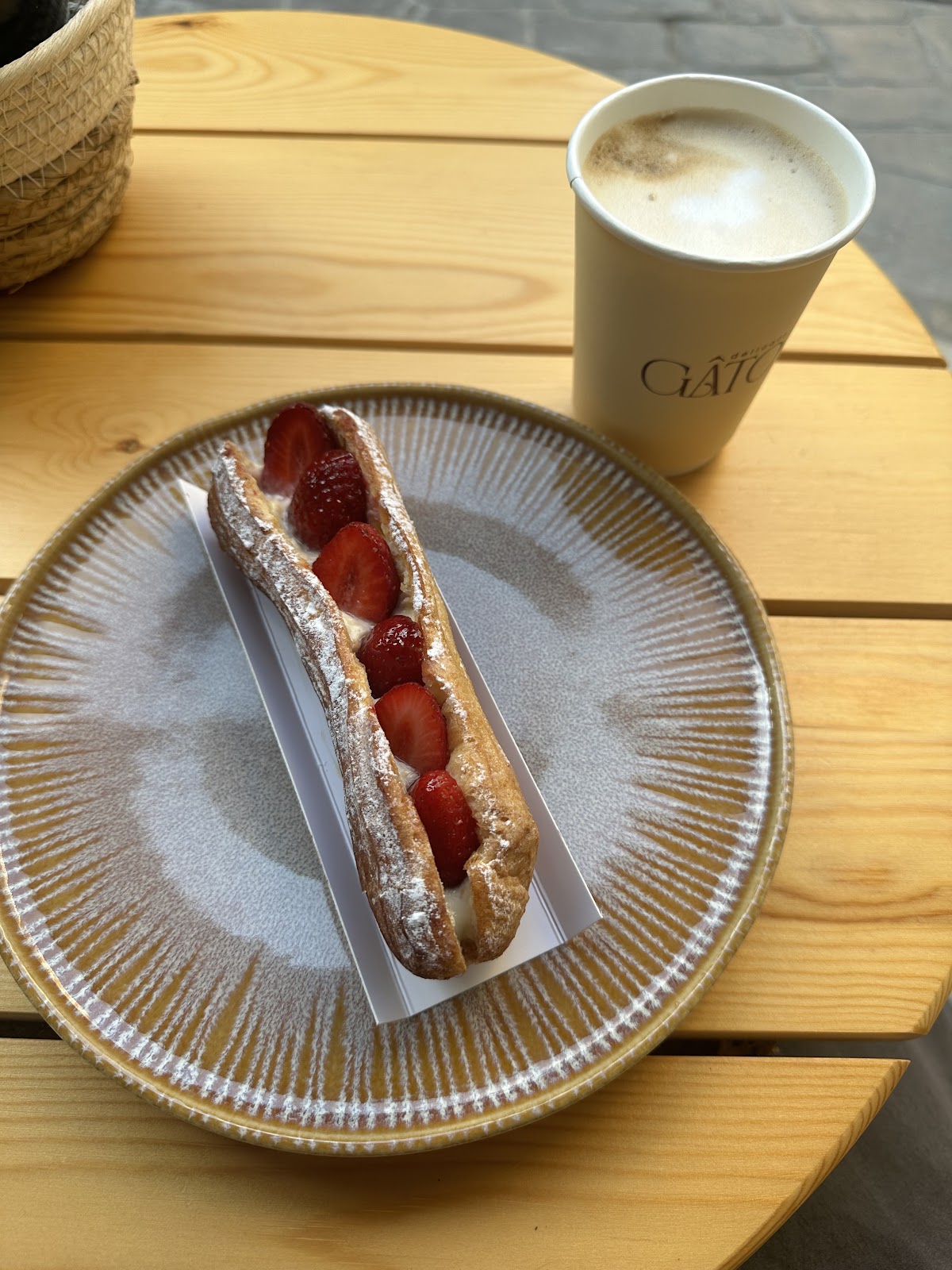 A strawberry mille-feuille on a ridged ceramic plate