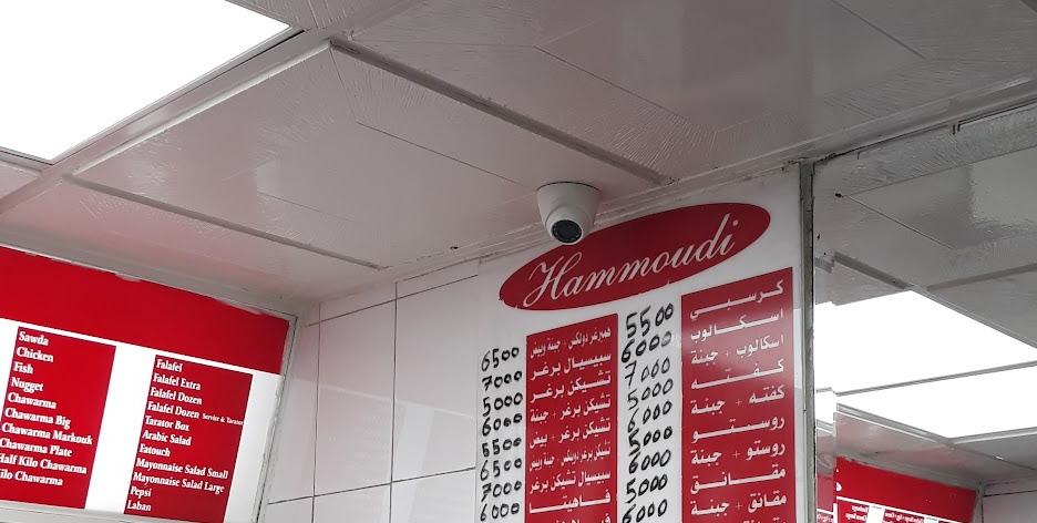 The red board wall above the counter inside the room