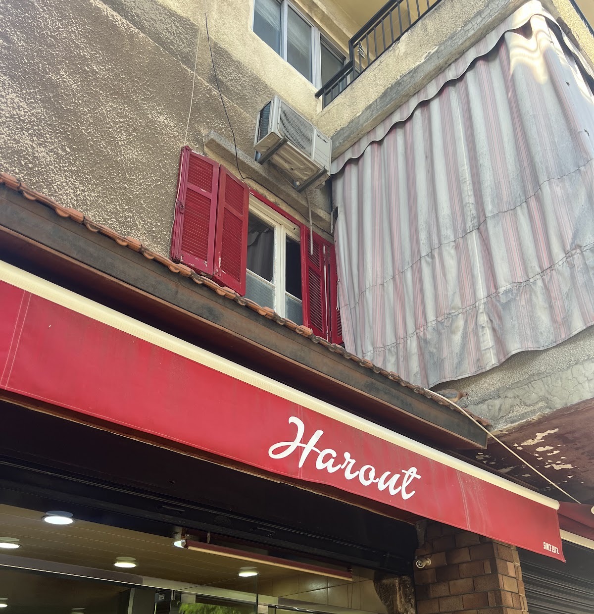 The red Harout awning over the bakery door on Rue Masaken, Bourj Hammoud