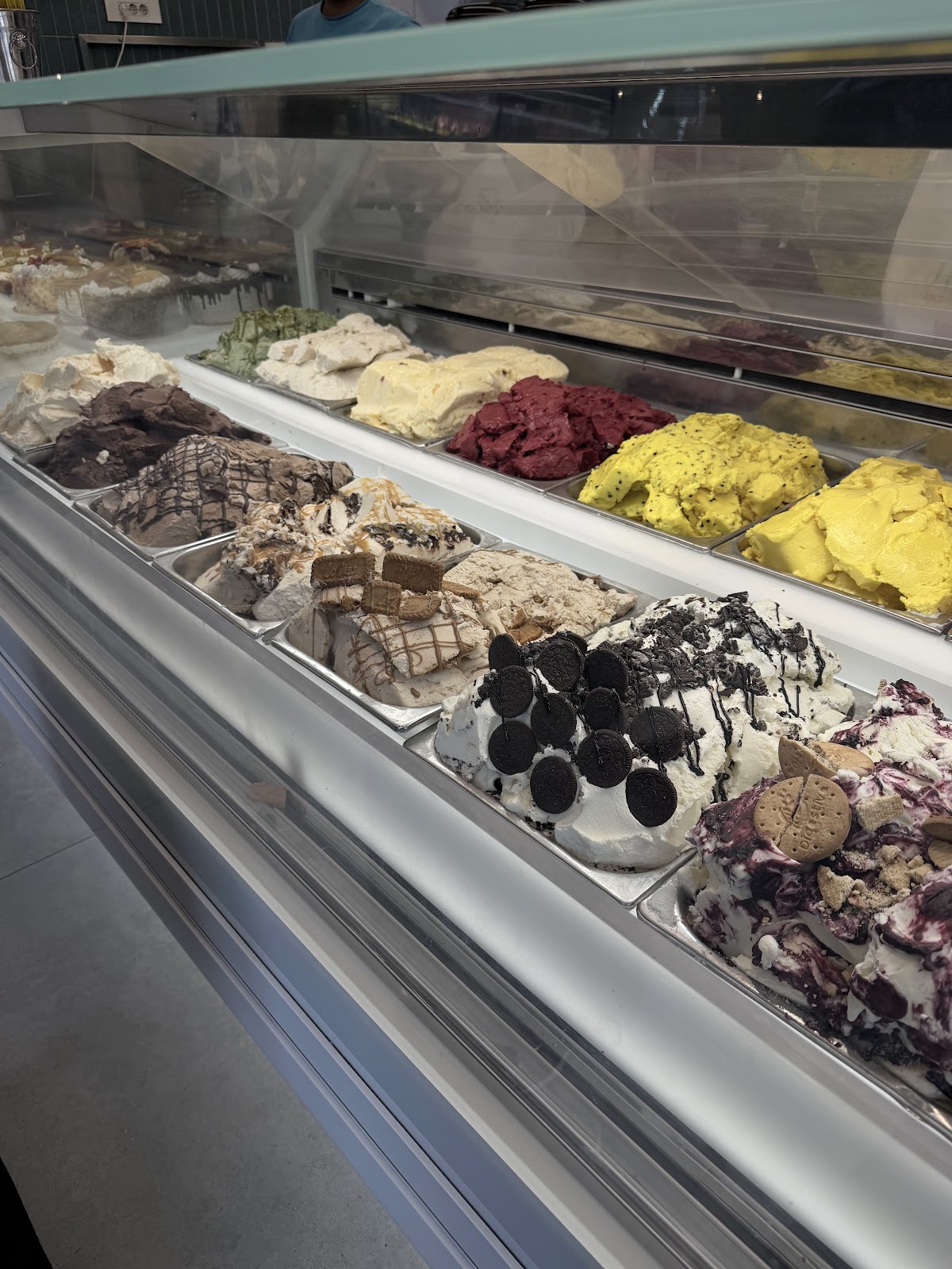 The gelato counter, trays of flavours under glass
