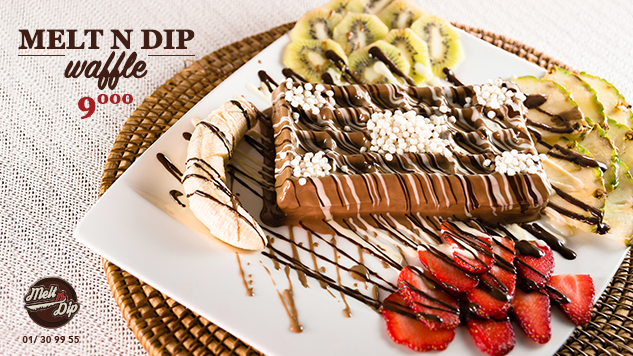 A waffle with kiwi, strawberry and chocolate