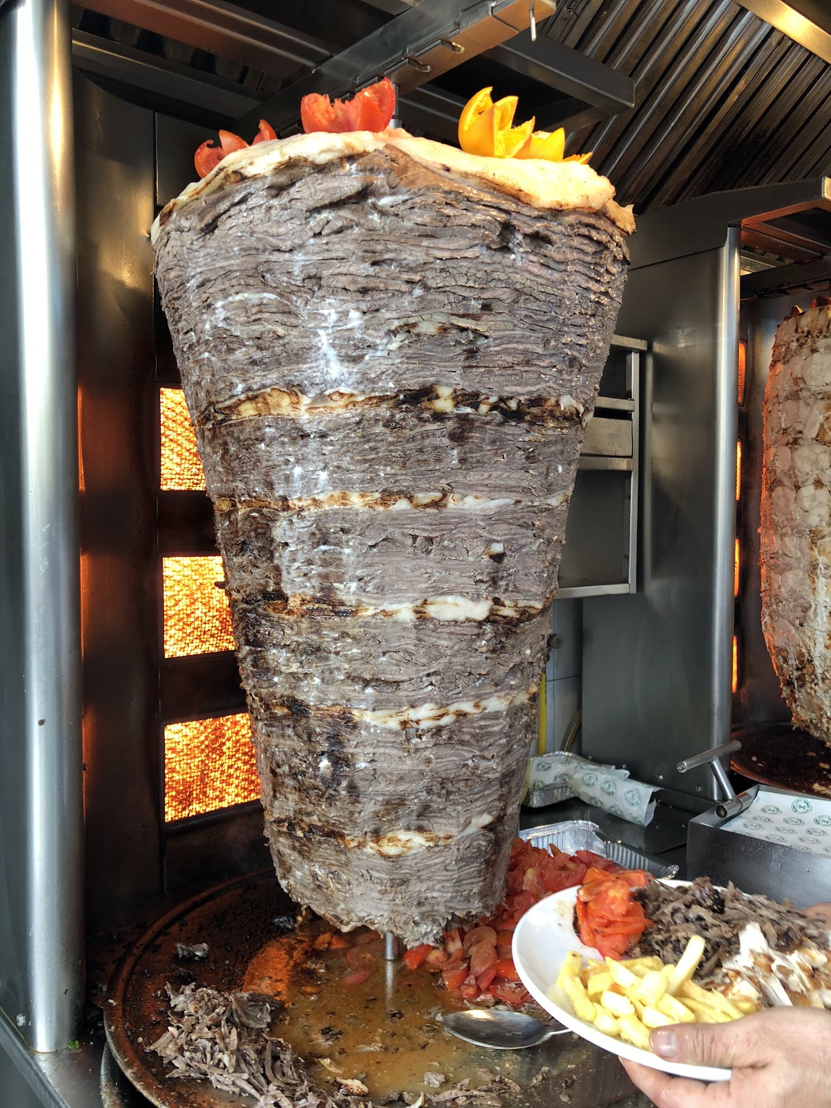 The meat shawarma cone turning on the spit at Restaurant Joseph