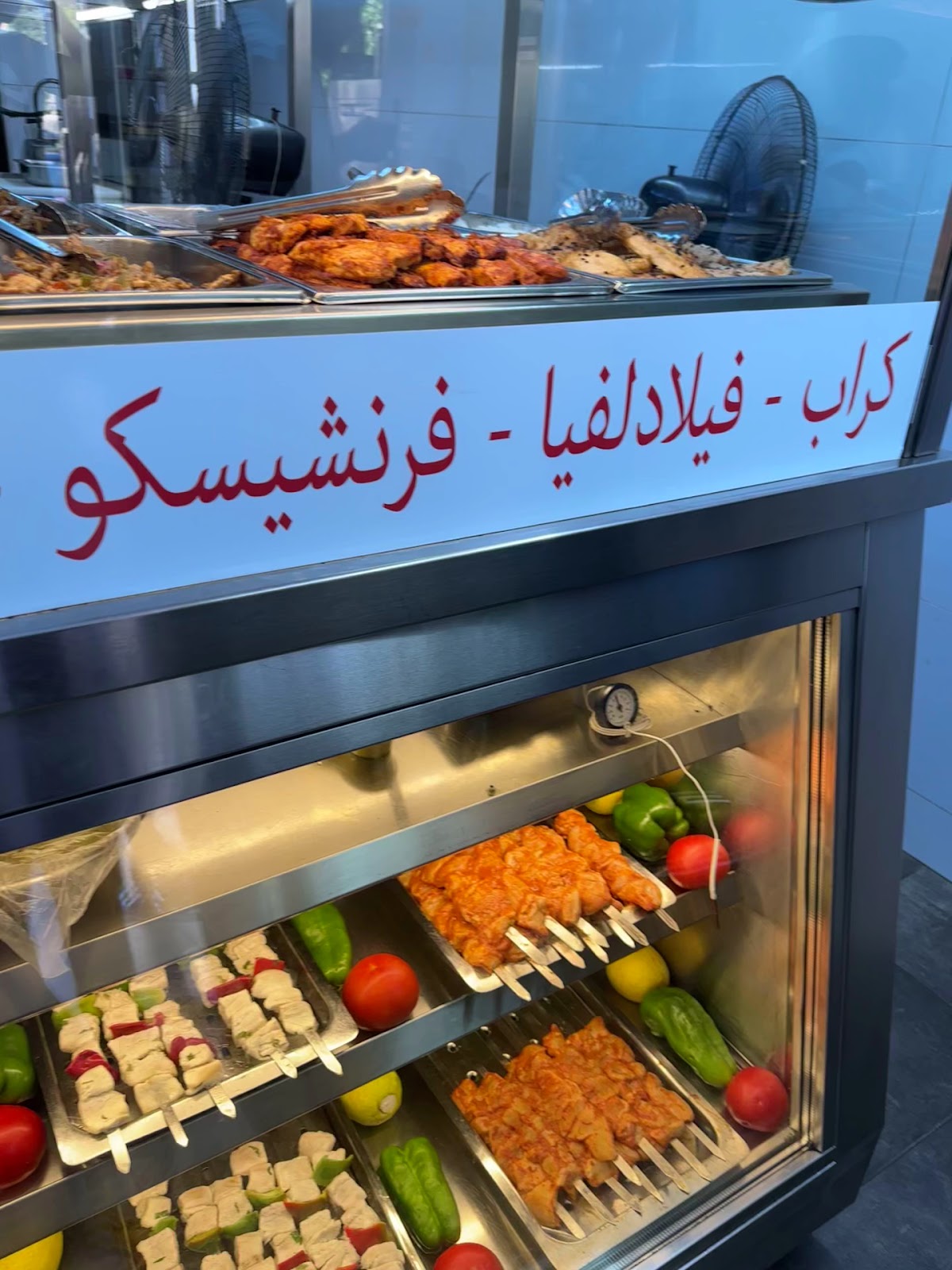 Kebab skewers lined up in the display case