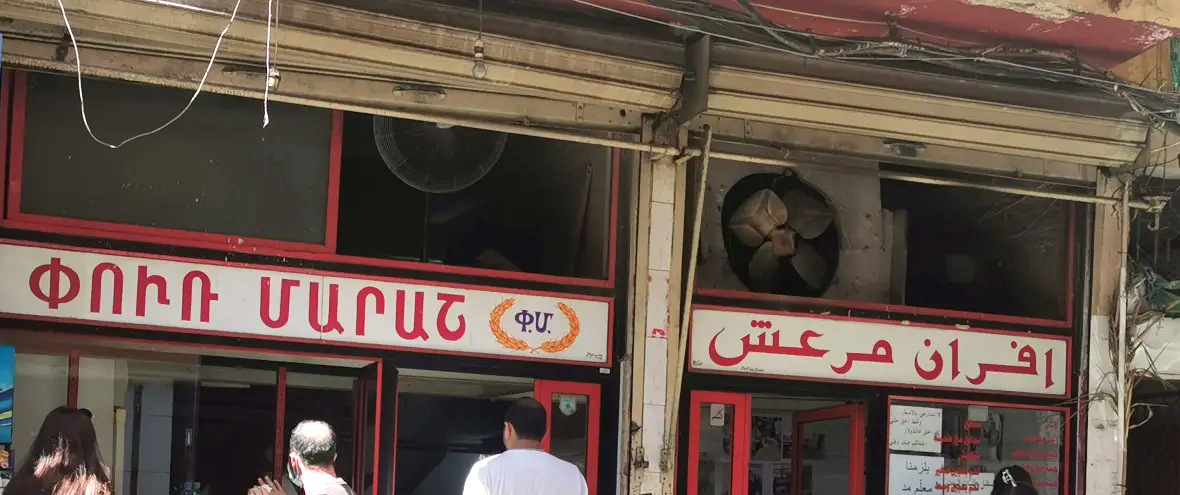 The red and white sign of Afran Maraach on Maraach Street, lettered in Armenian and in Arabic