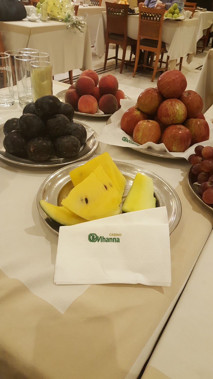 The fruit table: watermelon, apples and avocados on platters