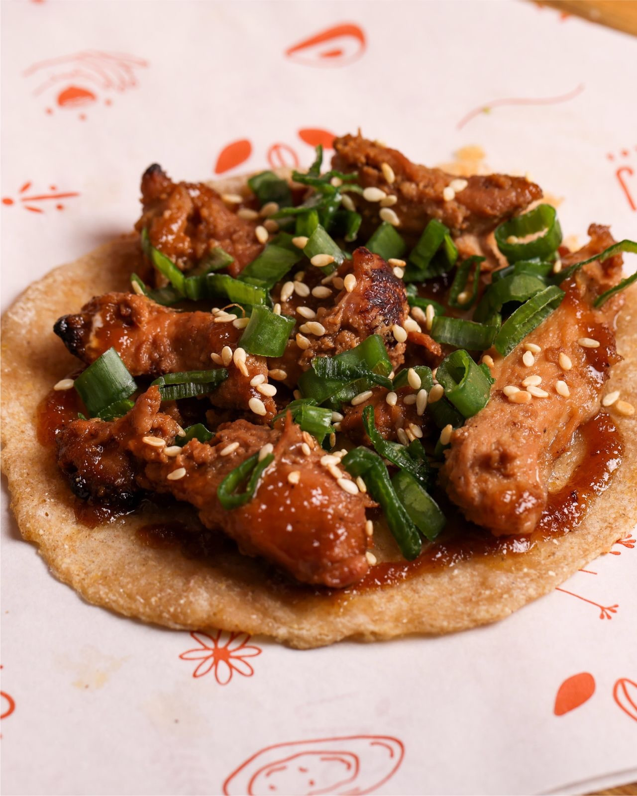 The poulet laque saj, marinated chicken with spring onions and sesame