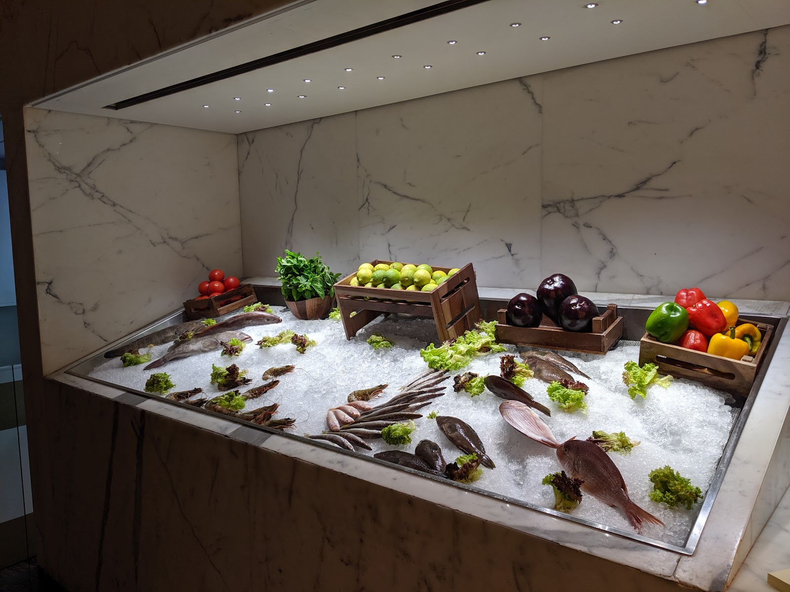 Seray's fish counter, whole fish laid on crushed ice under the marble hall