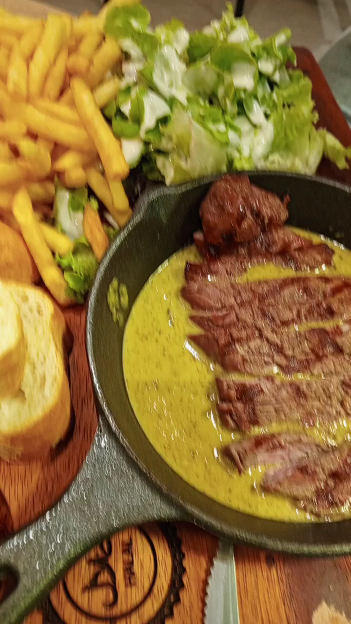 Beef steak sliced in the skillet, close up