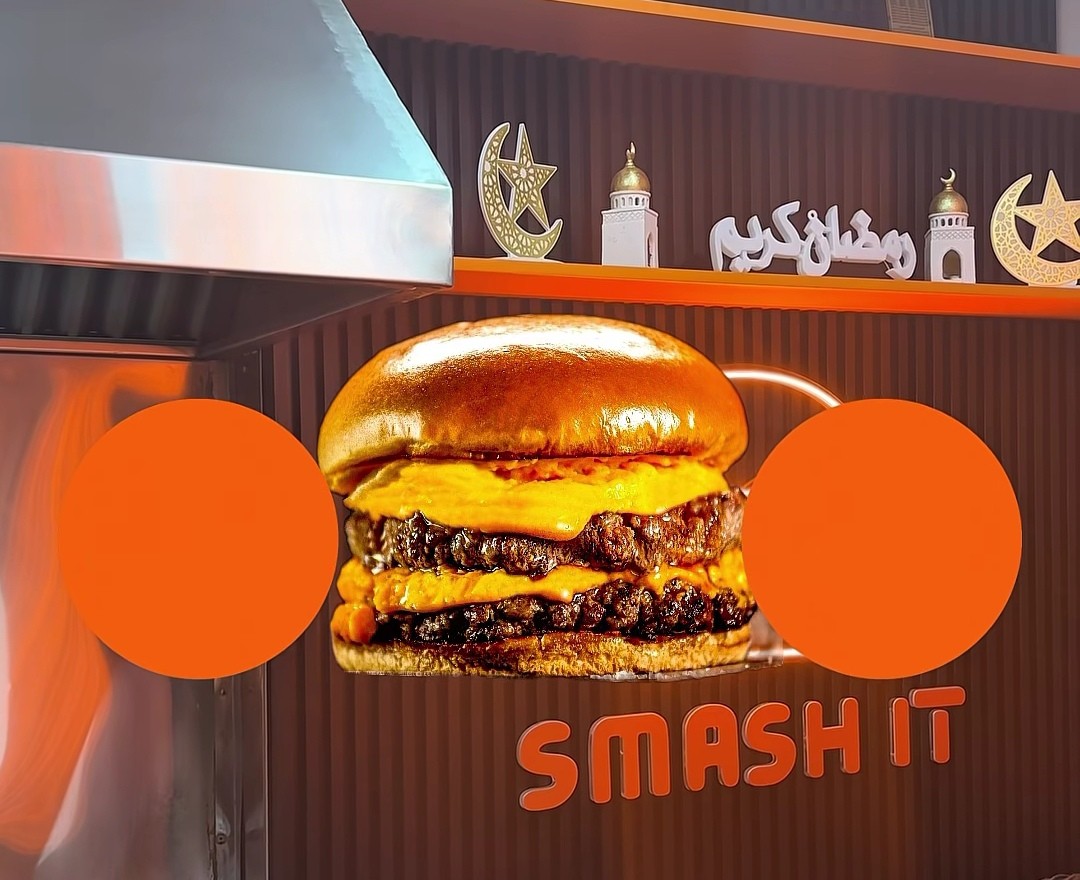 The neon burger sign on the Smash It counter wall