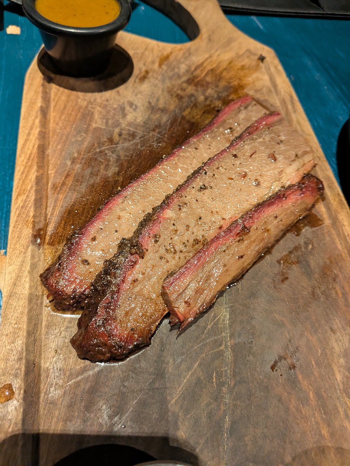 Brisket slices showing a pink smoke ring
