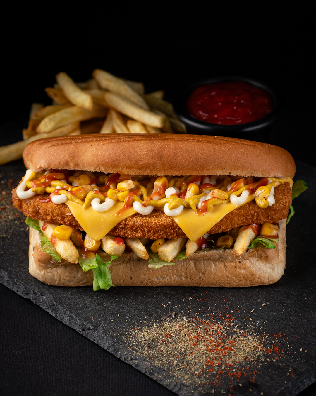 A chicken sub loaded with cheese and corn