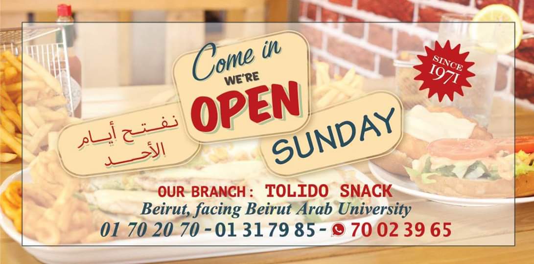 The Tolido banner announcing that they open on Sundays, printed with Since 1971