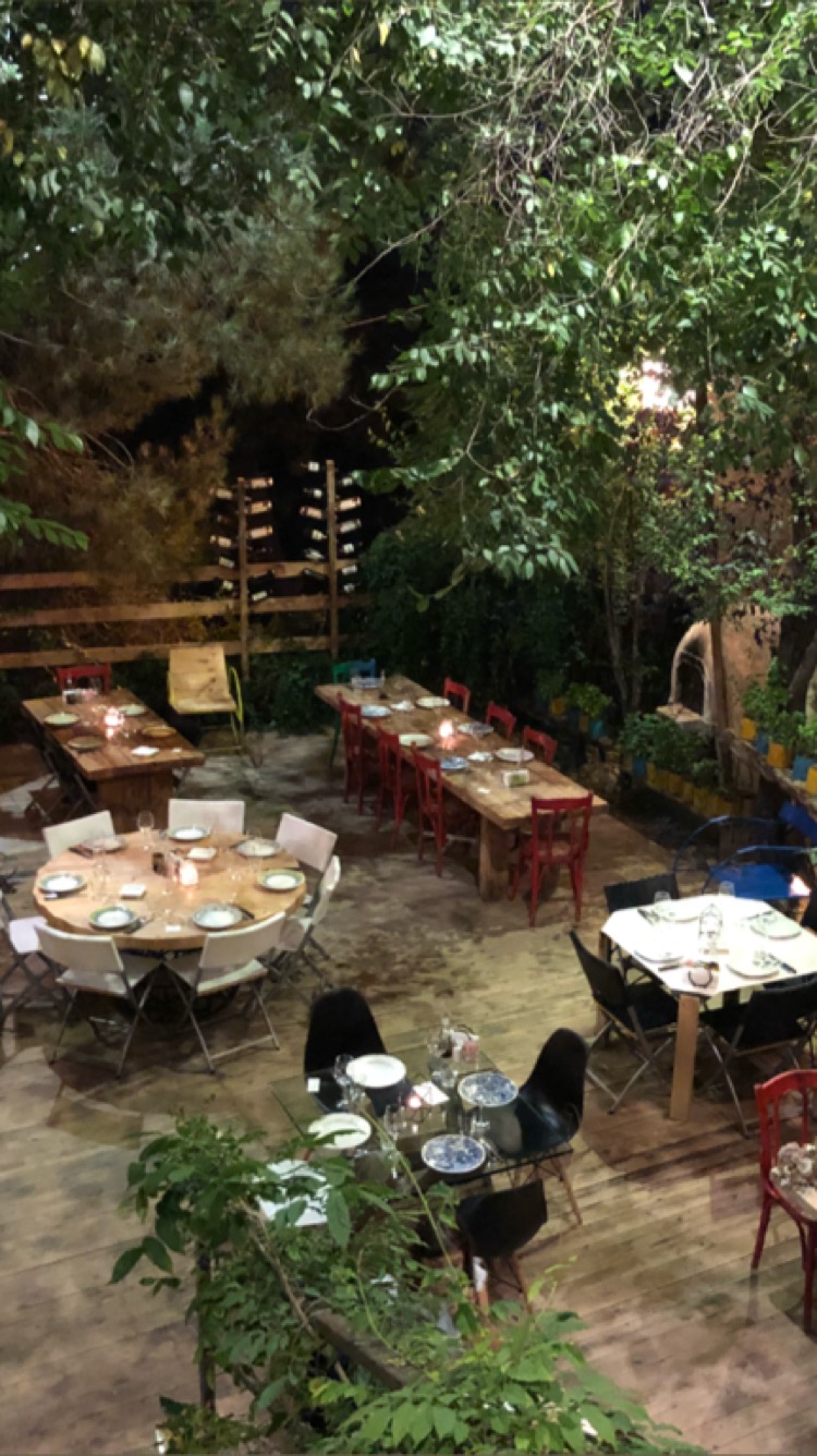 The garden terrace tables under the trees