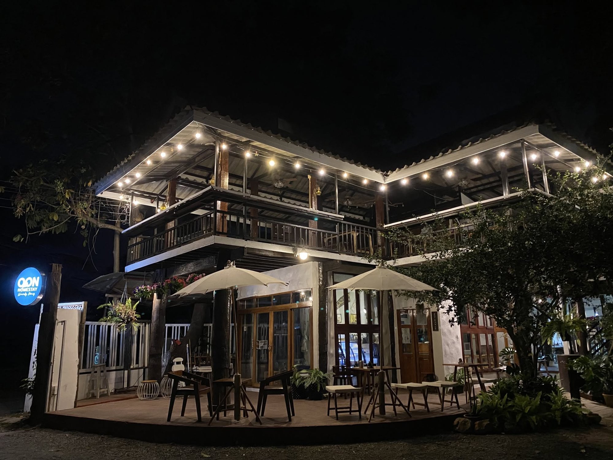 OON Café lit with string lights at night