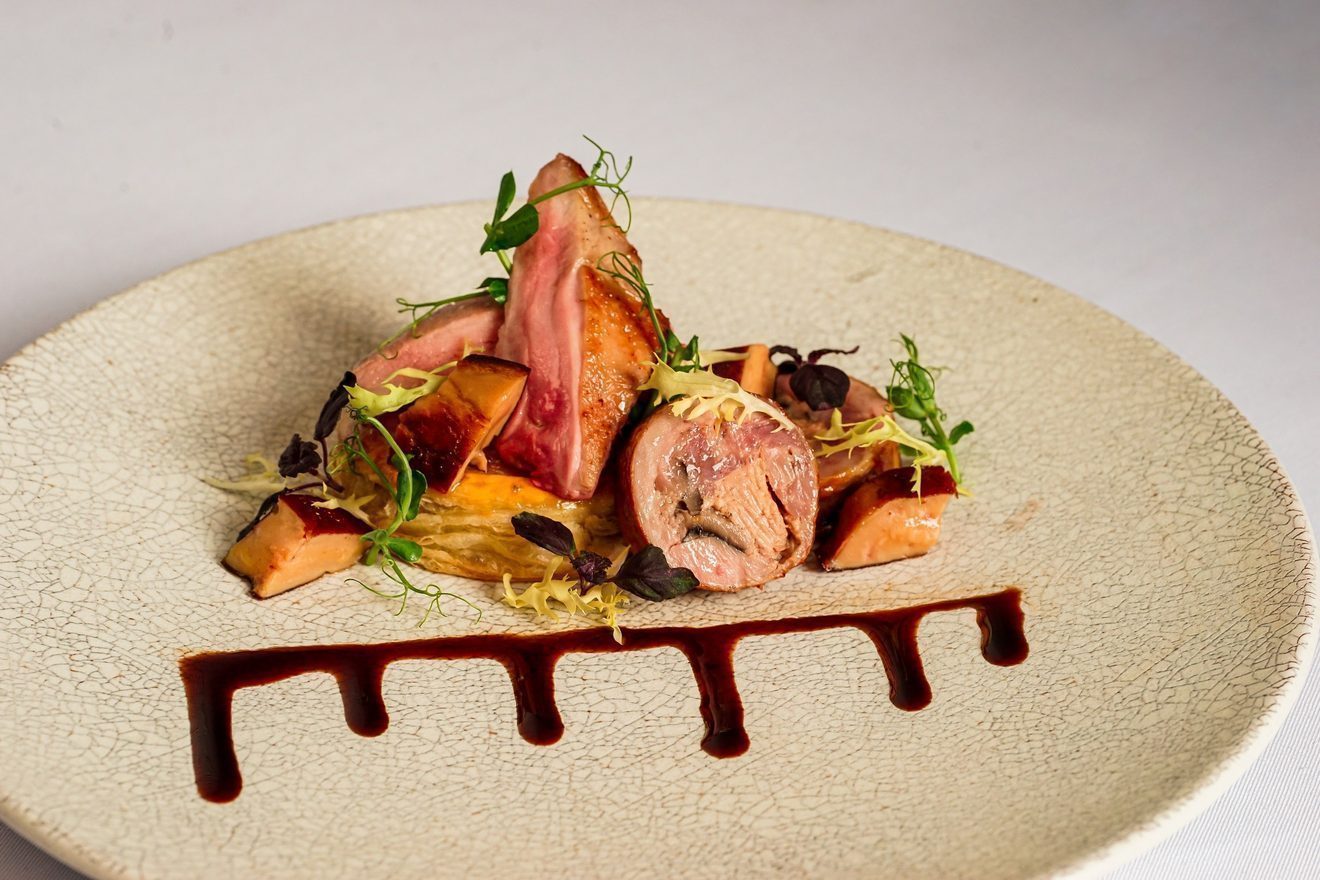 A plated main course on crackle-glaze ceramic at A Lux