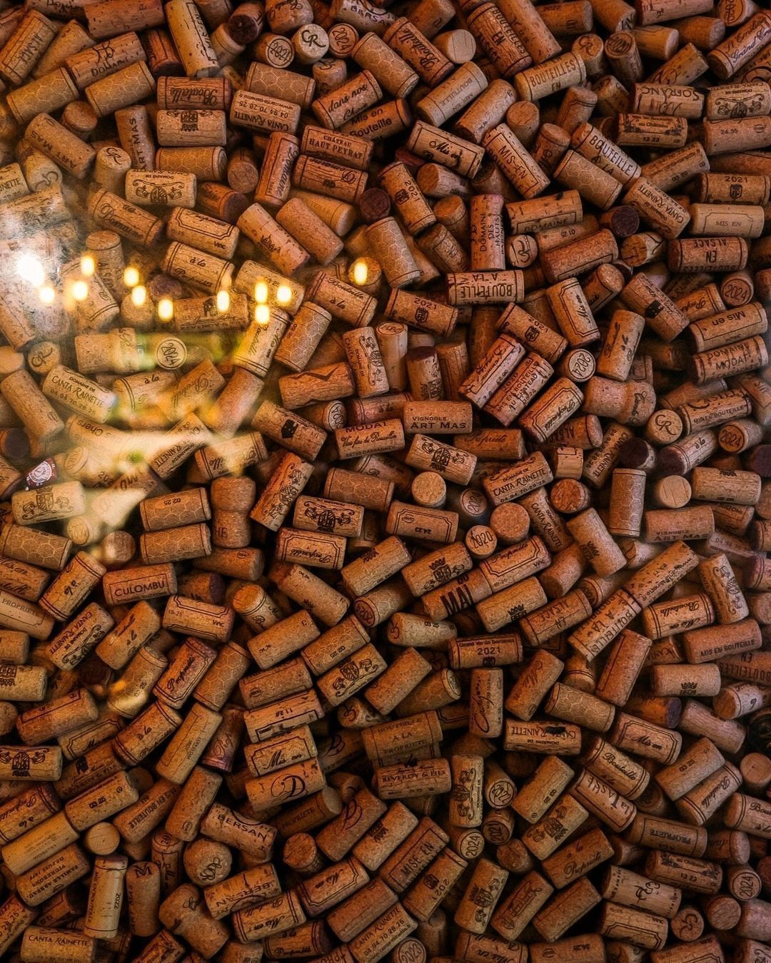 The wall of used wine corks at CORKS, filled floor to ceiling