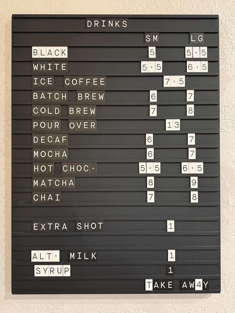 The Commune drinks letterboard with small and large prices