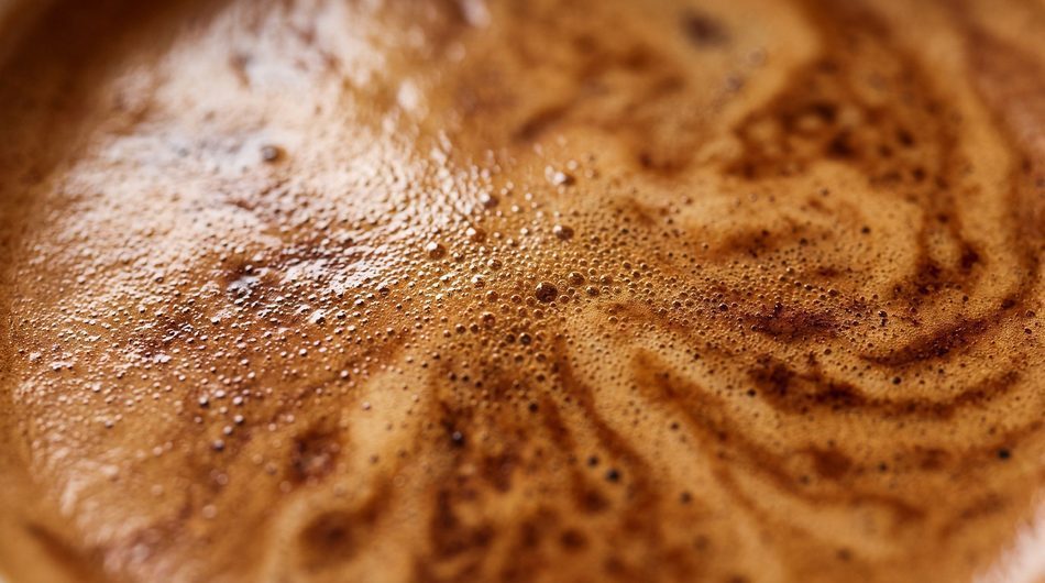 Still life: the crema surface of freshly brewed coffee
