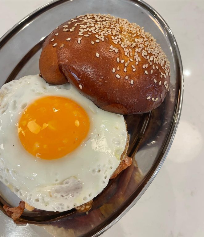 The breakfast burger with a fried egg at Heart Coffee